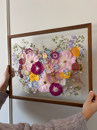 Preserved wedding bouquet displayed in a popular 16×20 floating glass frame