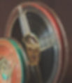 Coloured picture of two old film reels - courtesy of www.pixabay.com