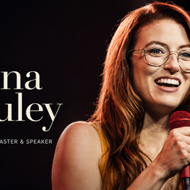 Fiona Cauley performing stand-up comedy during a live show