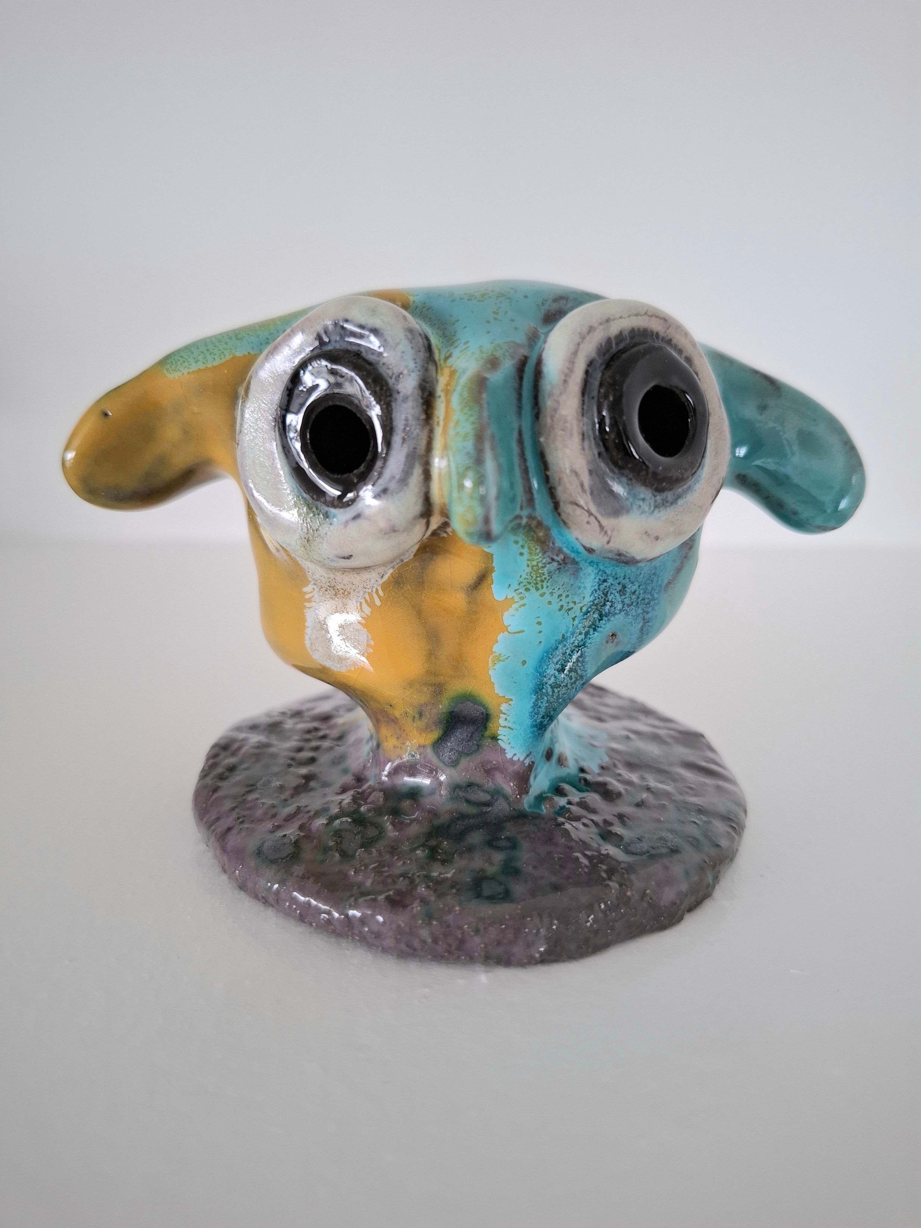 Klogeåge figur i keramik