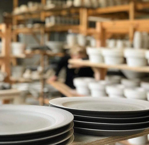 Tibirkebakker tableware set drying in the production hall, awaiting the first firing