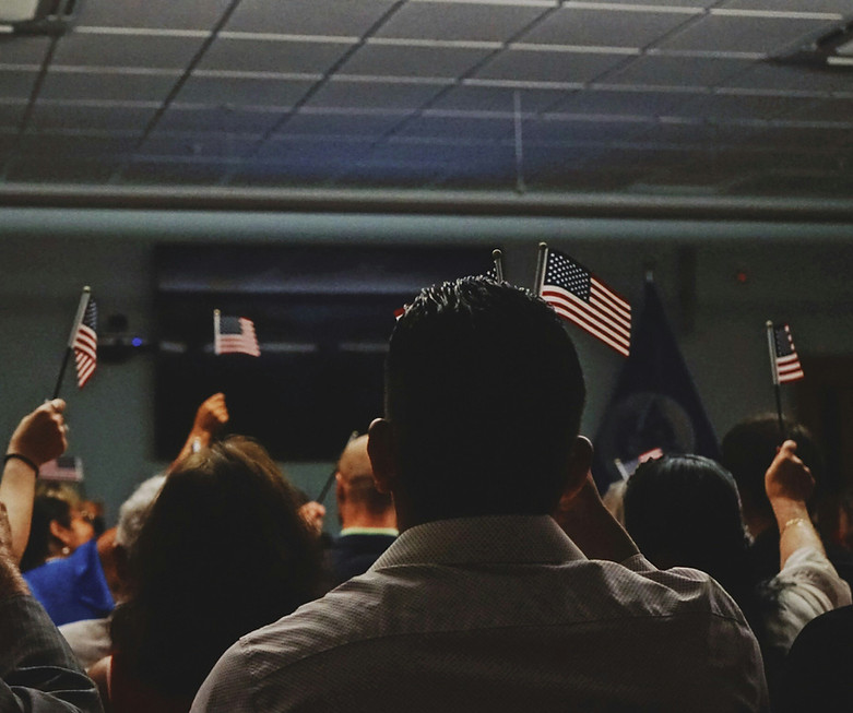 People waving the American flag