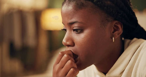 black teen girl looking worried and scared with hands in her mouth