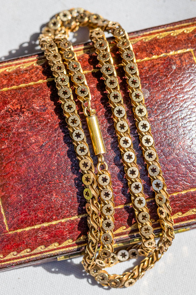 Antique 15ct gold star chain necklace, c.1890–1910, with pierced star details, rich natural patina and barrel clasp.