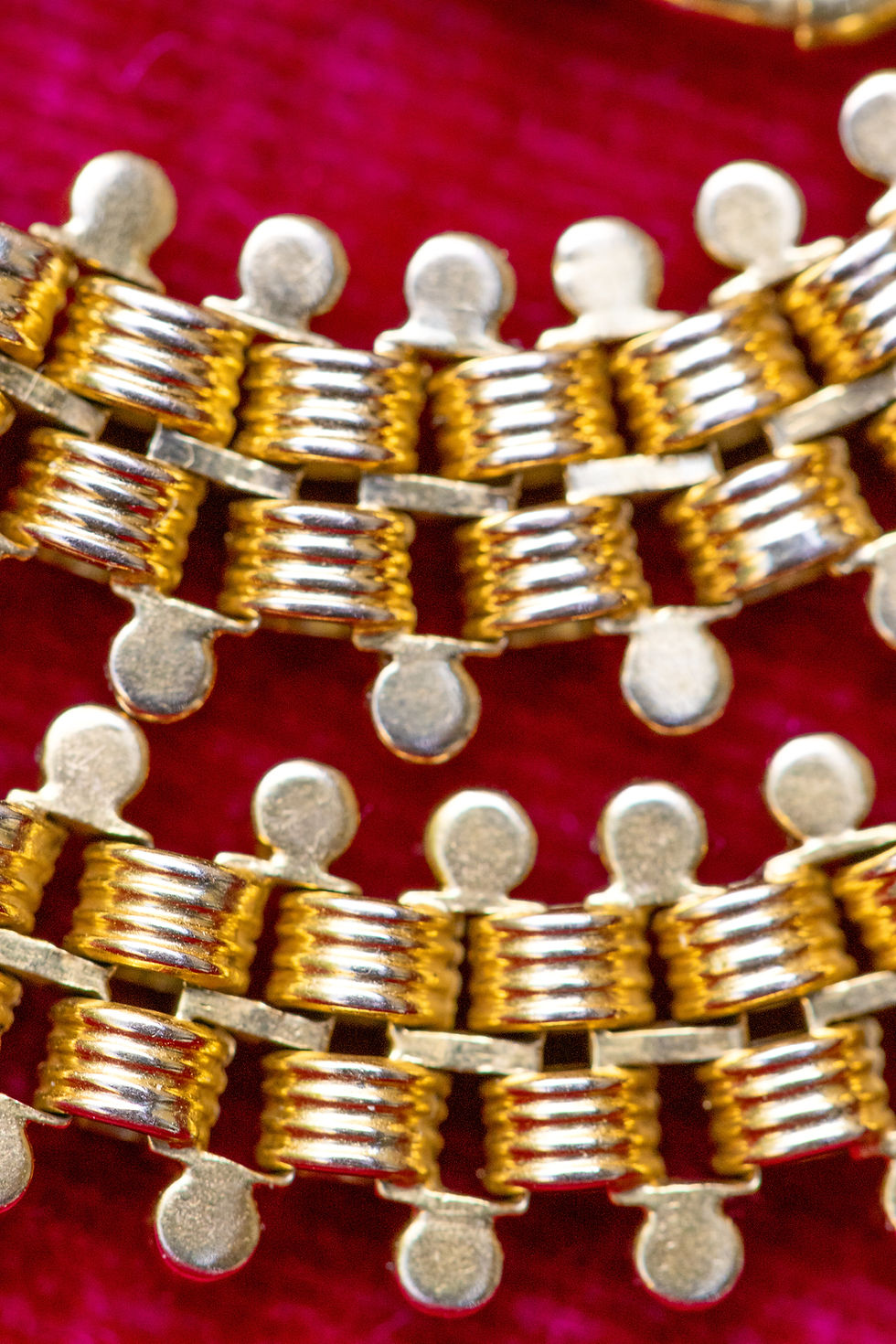 Thumbnail: Macro close-up of 18ct gold repoussé watch chain showing the link details.