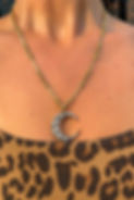 Model wearing the old cut diamond crescent pendant with removable brooch fitting.