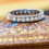 थंबनेल: Overhead image of 1.75ct transitional cut diamonds in a continuous platinum eternity setting.