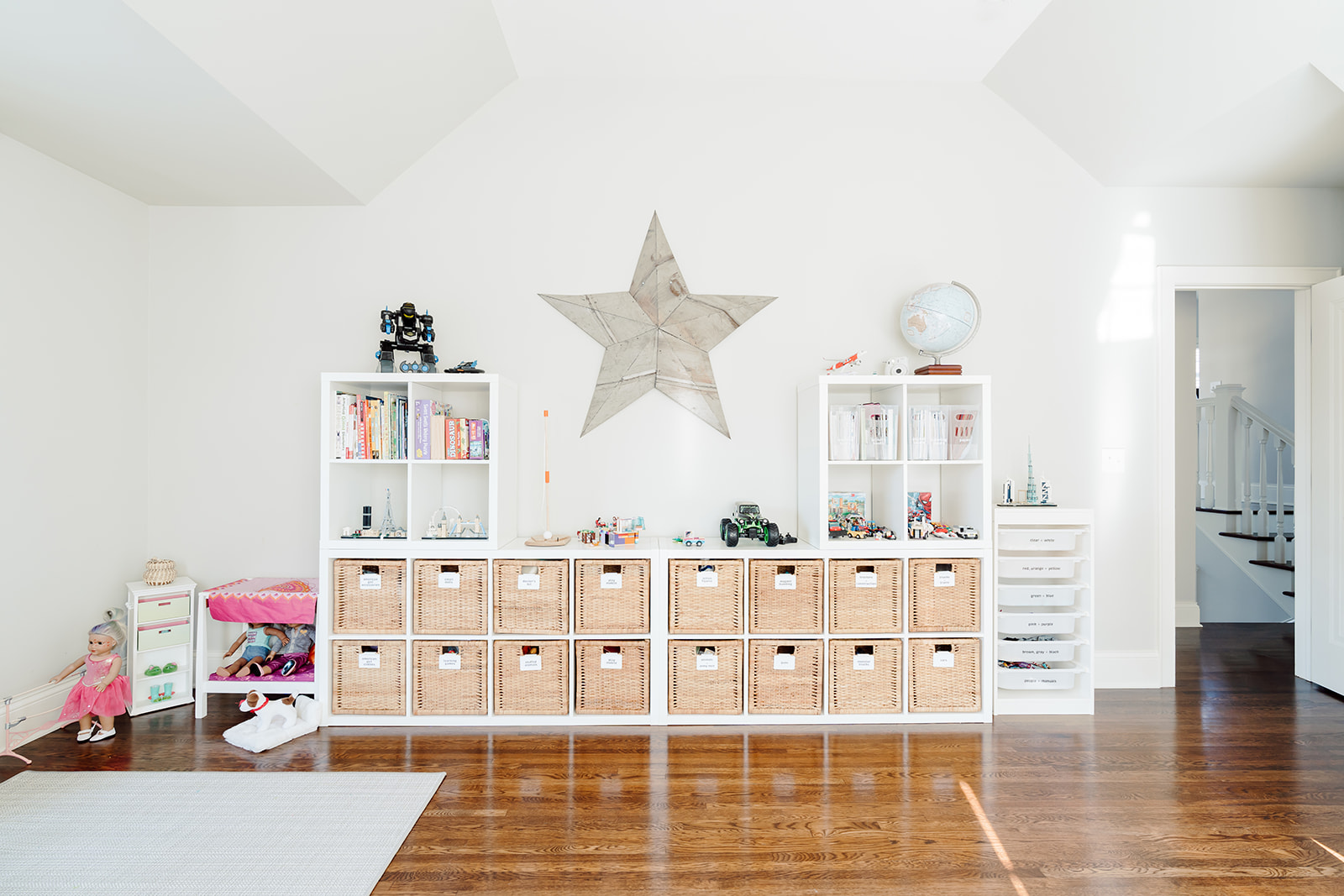 A playroom with a cube storage unit and storage baskets that fit perfectly in the open cubbies.