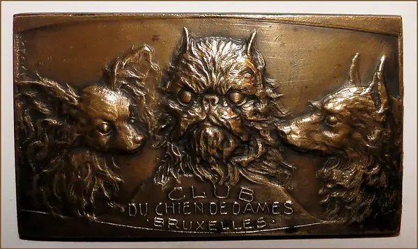 Pictured above An antique dog medal from the BelgiumFrance area, that shows three breeds a