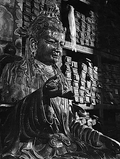 StatueWithSacredTexts.webp