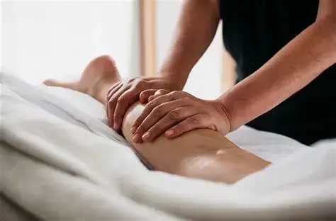 Eye-level view of a serene spa room with a massage table and soft lighting