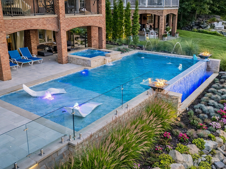 Lakeside infinity pool in a Michigan backyard.