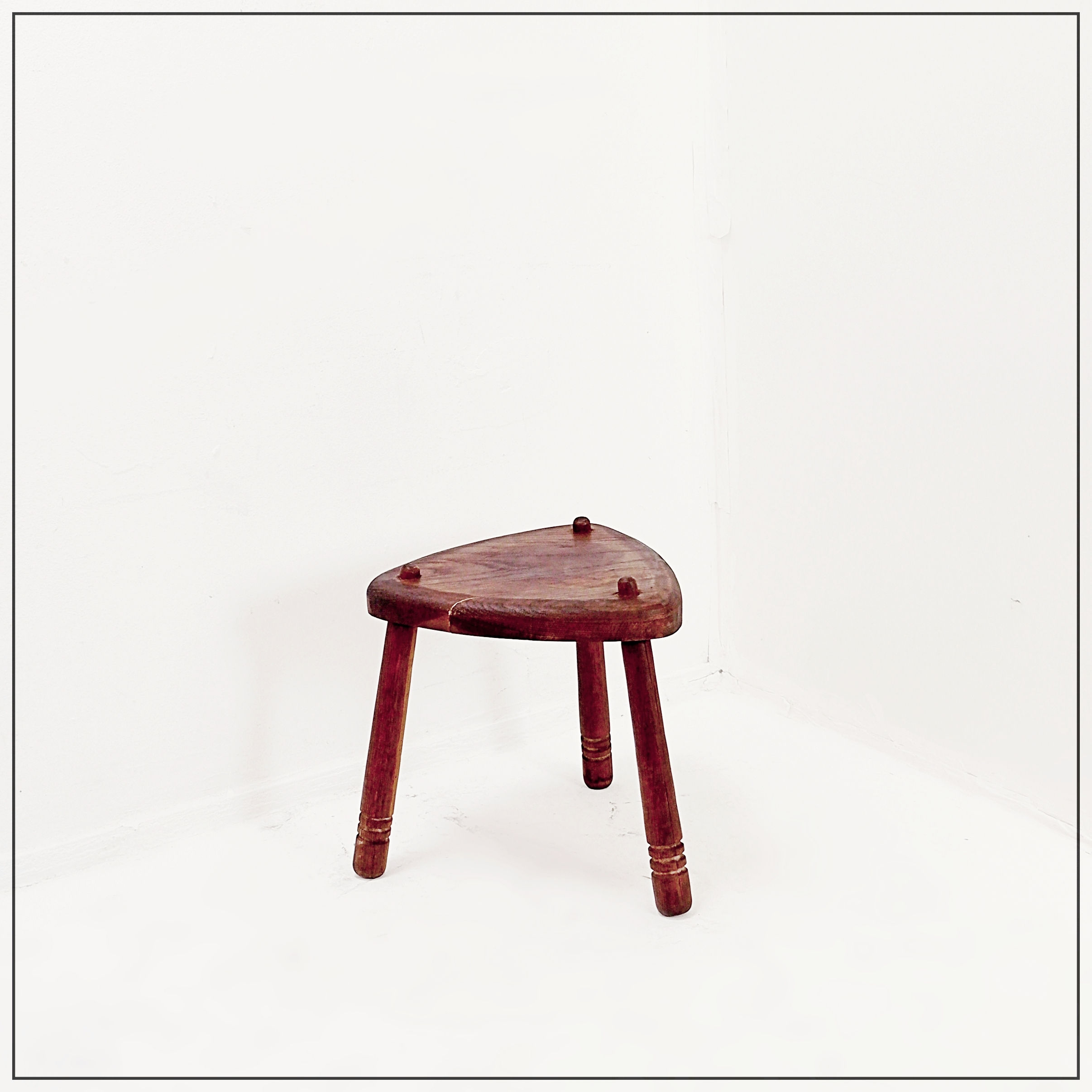 Rustic tripod stool with a triangular seat , 1960s