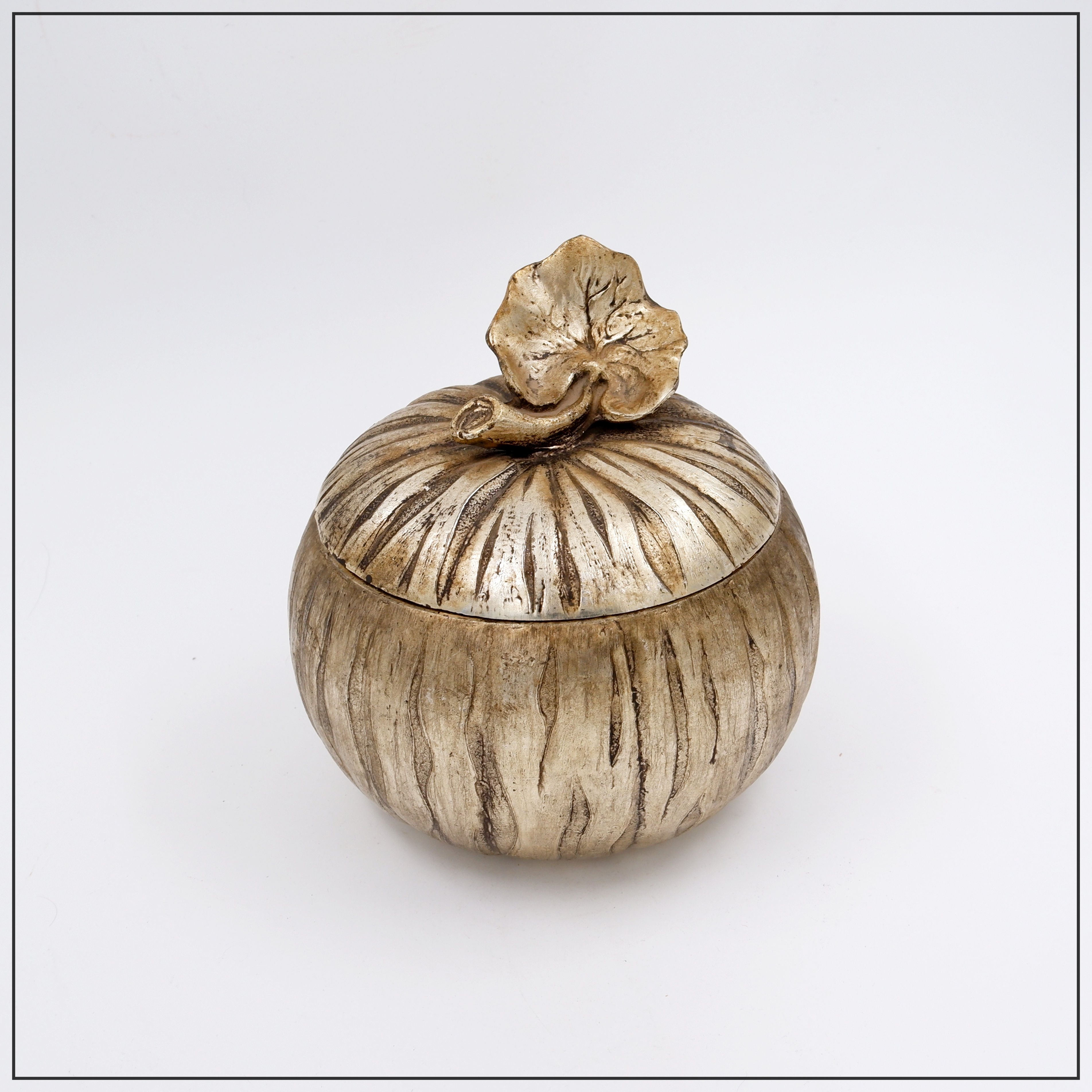 Pumpkin-shaped ice bucket with textured details on the skin and leaves.