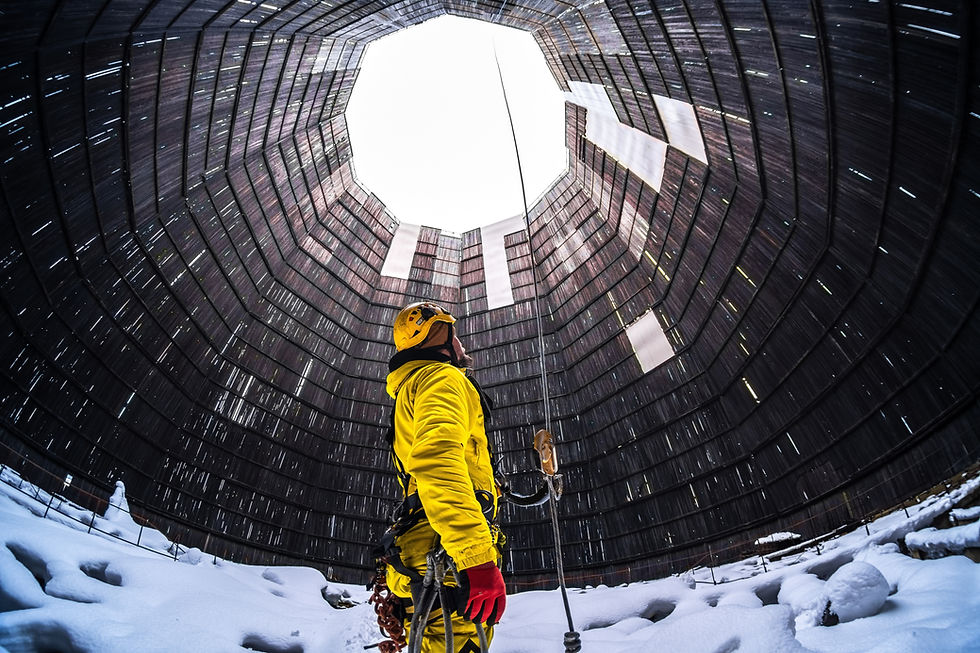 Rope access specialist in a cooling tower. A worker inspects the building.jpg