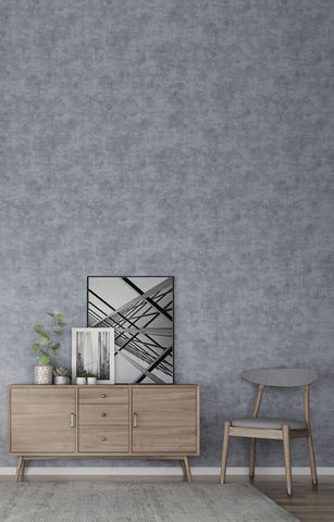 Grey textured wall, sideboard, chair, and art