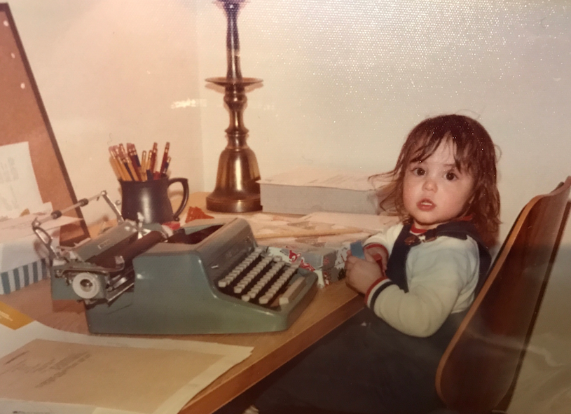 Me, age 2, at a typewriter