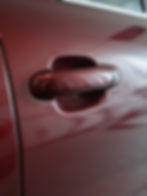 Polished car door handle after professional car detailing