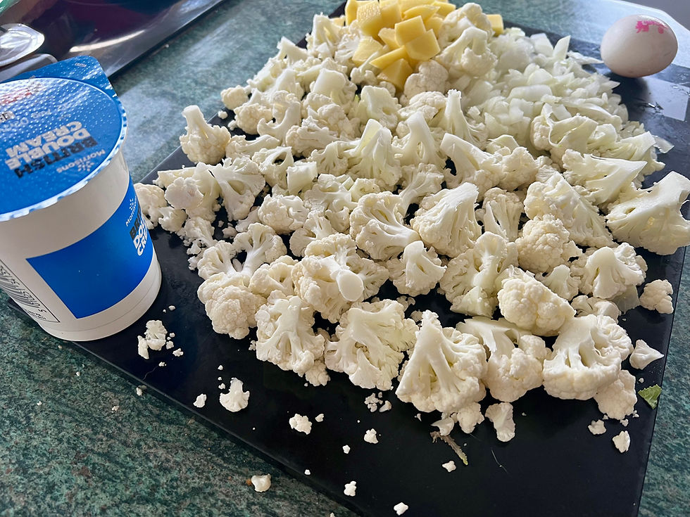 ingredients laid out for cauliflower soup on kitchen counter