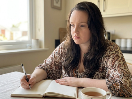 Woman creating her first digital product to sell online from home