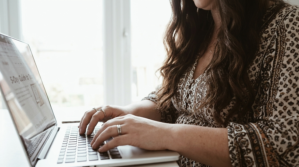 Hands writing a digital product description — showing how to create what is a digital product