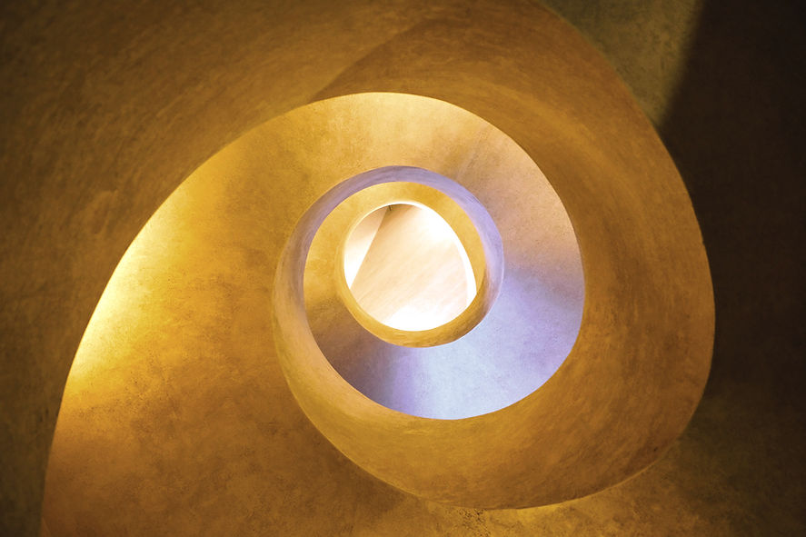 round brown concrete spiral staircase_edited_edited.jpg