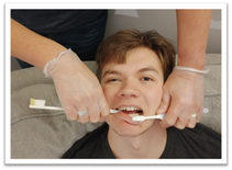 biting the toothbrush