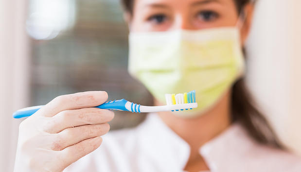 holding a toothbrush.png