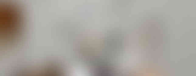 Virtually staged dining room with a glass table and white chairs, doors leading to the lanai