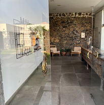 Retreat spa entrance with unique door sculptures