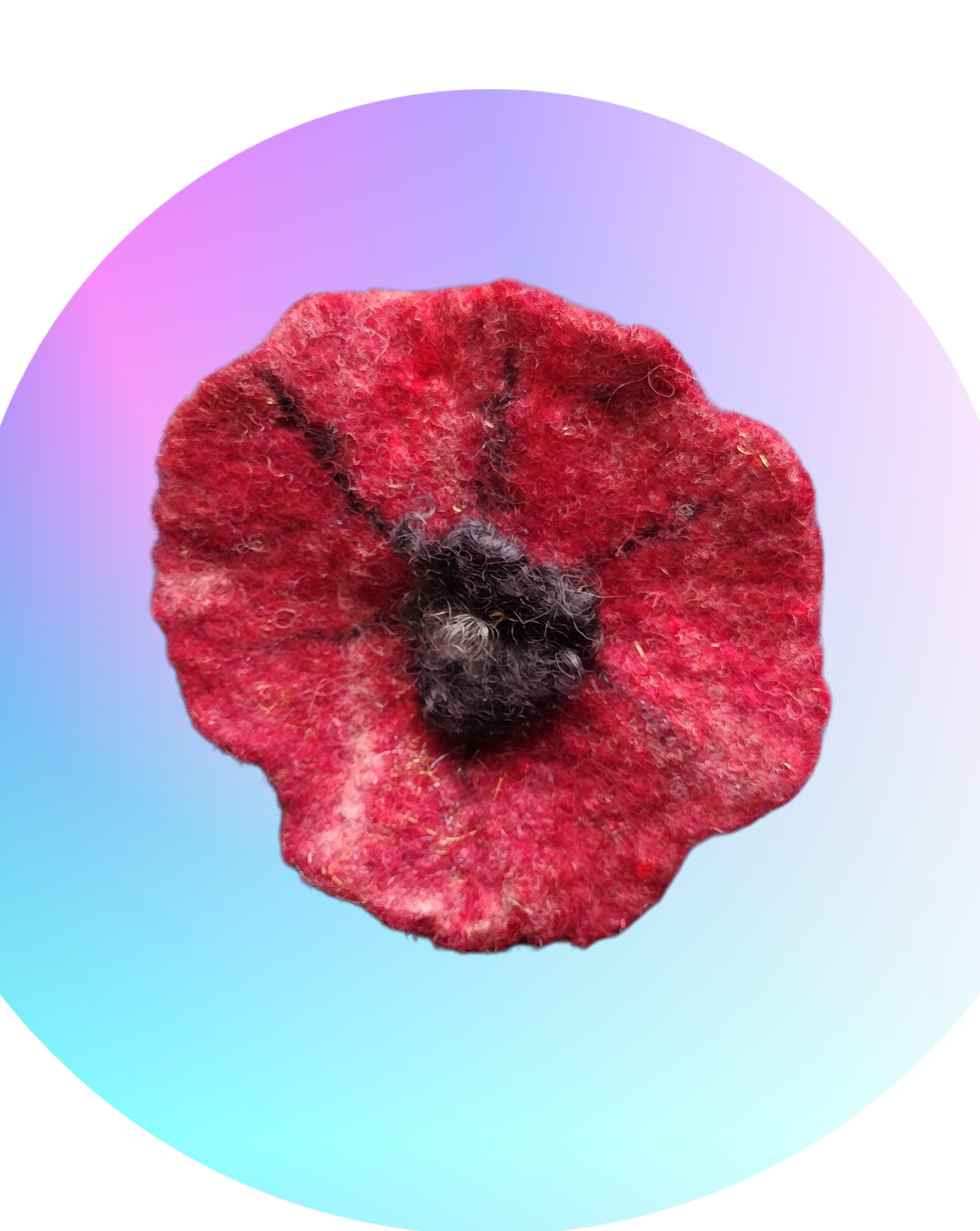 Poppy brooch with black lock centre