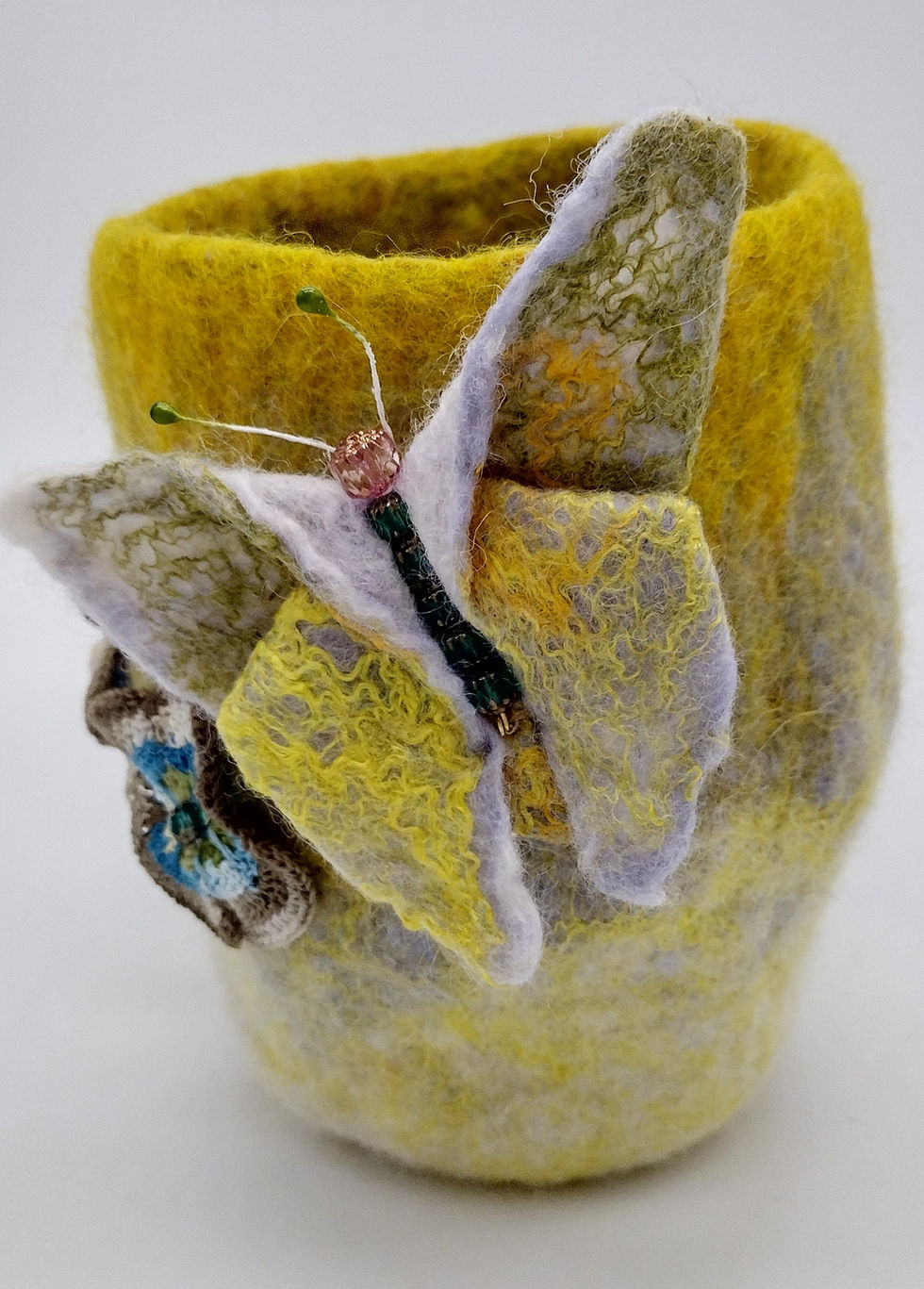 Wet felted origami butterfly in yellow and white wool and silk. Can be worn as a brooch
