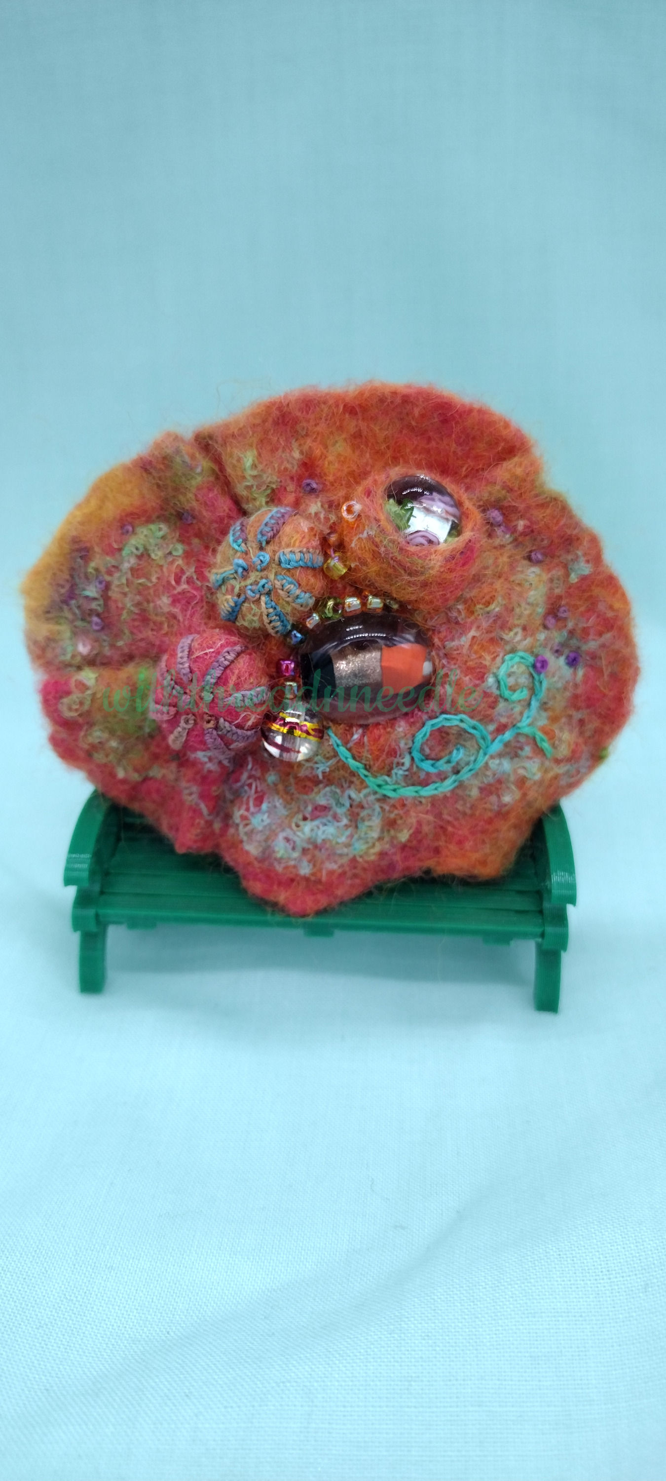 Orange colour felt hair slide Shibori style.