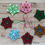 Thumbnail: seven different colour seed bead decorations in a flatlay