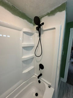 Cast iron tub removal and new fiberglass tub and shower surround installation