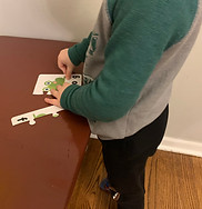 young man standing at a table