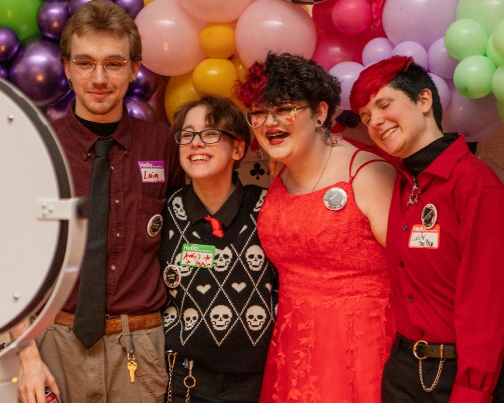 A group of Prom Project attendees have fun posing for the Selfie Camera!