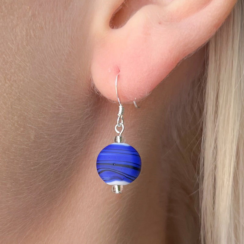 Model Wears Rainbow Strata Colourful Beaded Dangle Earrings In Royal Blue