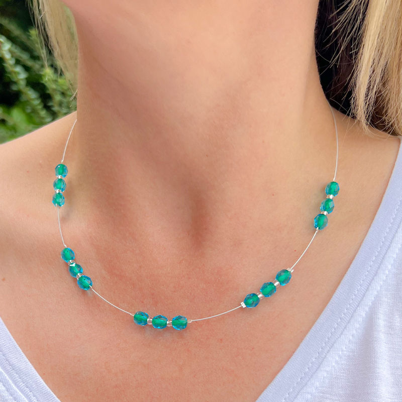 Model Wears Filaments Fire Polished Spaced Beaded Necklace In Teal Green
