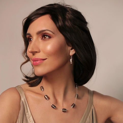Model wearing Reflections beaded necklace and earrings