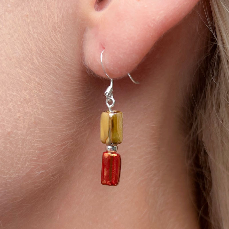 Model wears Ceramic Glazed Beaded Drop Earrings in mustard and brown glazed greek beads