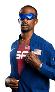 Lex Gillette with short black hair and goatee wears reflective blue sunglasses and a blue jacket over a red striped uniform. On his chest are the white letters U S A and a patch of the U.S. flag.