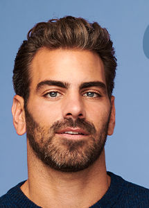 Headshot of Nyle DiMarco with short, styled dark hair and dark facial hair with text that reads Being Deaf is part of what uniquely colors the small space of the world that I take up. It is the core of my identity, and I'm damn proud of it.