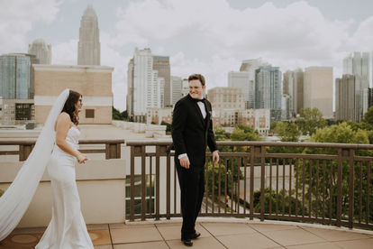 A Charlotte skyline first look between bride and groom