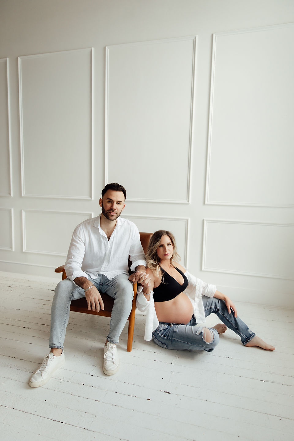 Expecting couple during studio maternity session by Charlotte maternity photographer