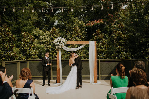 A NC wedding photographer captures a bride and groom's first kiss on their wedding day