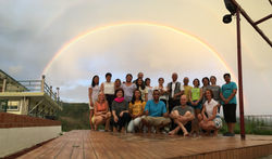 Our team in front of the rainbow on the dance floor