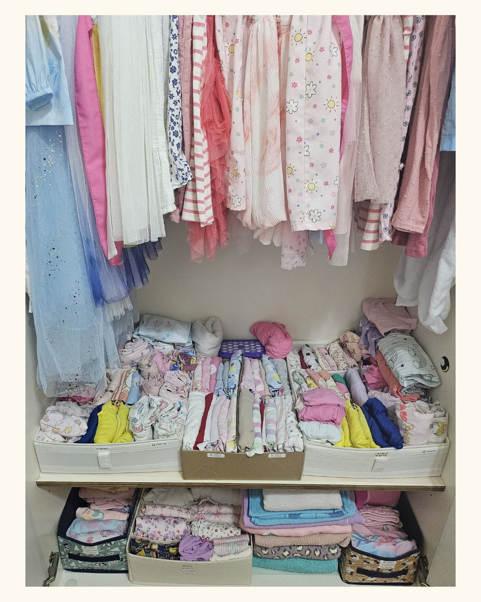 clothes tidied within kids reach for easy retrieval. clear labels.