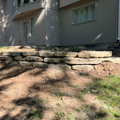 Retaining wall construction near house