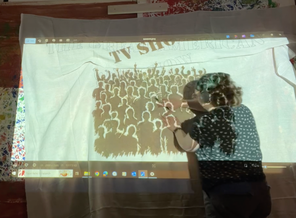 Using an overhead projector to transfer a design onto material